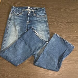 7 for all mankind boot cut flare jeans. Size 27. Medium wash. Faded front.